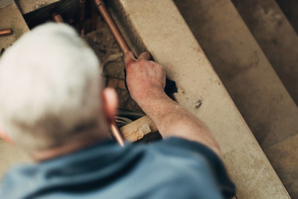 Heatmyhohm performing general plumbing work in a house.